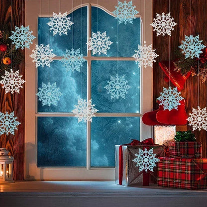 Decorative window with snowflakes, Christmas presents, and a red chair.