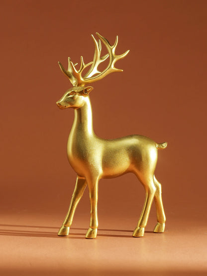 Gold deer figurine on a brown background