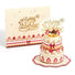 Miniature birthday cake with 'Happy Birthday' topper and matching card on a white background