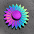 Colorful sunflower-shaped object on a textured black surface