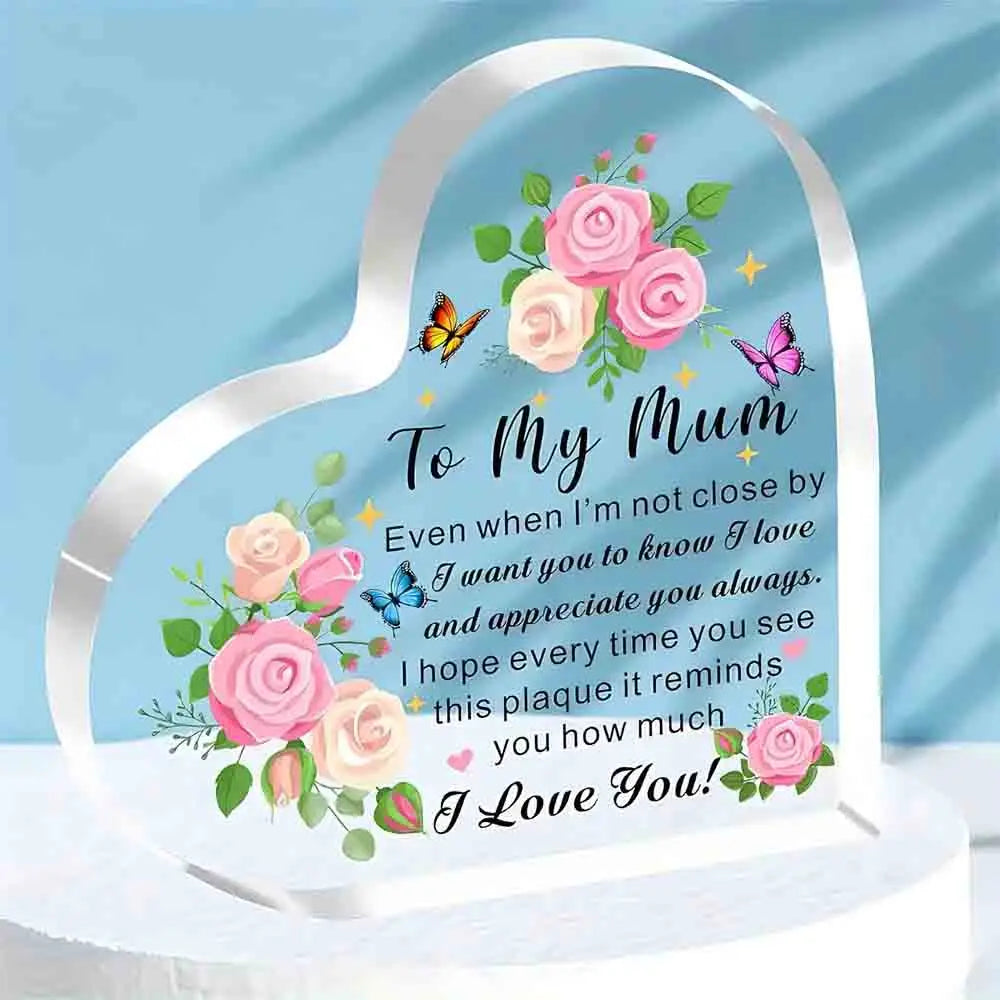 Heart-shaped plaque with floral design and message to 'My Mum' on a blue background