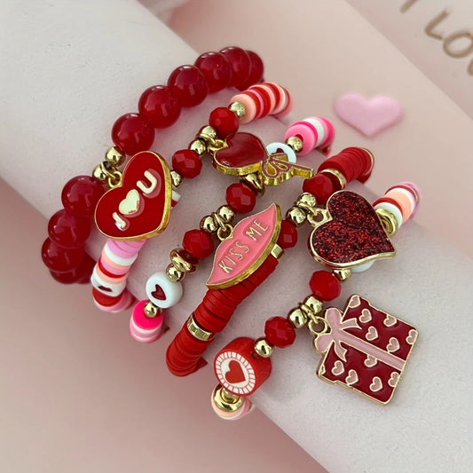 Colorful beaded bracelet with heart-shaped charms on a pink background. Valentines Day Party Bracelet
