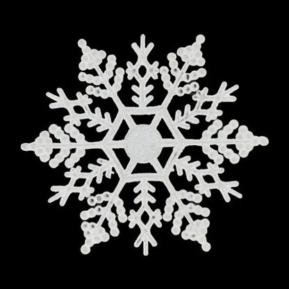 White snowflake-shaped decorative item on a black background