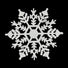 White snowflake-shaped decorative item on a black background
