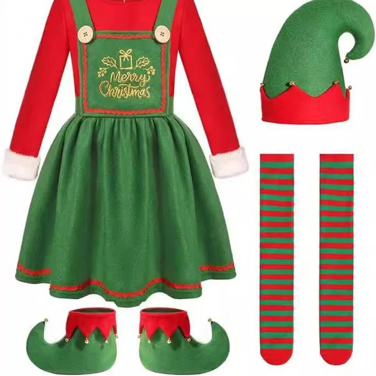 A Christmas elf costume set displayed on a white background, including a red and green dress with 'Merry Christmas' embroidery, a green elf hat with red trim, red and green striped socks, and green elf boots with red tips. 