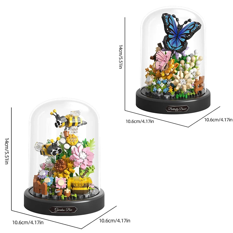 Two decorative sets with bees, flowers, and a butterfly inside glass domes, with measurements provided.